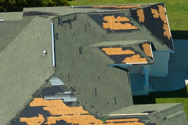 wind-damaged-house-roof-with-missing-asphalt-shing-2026-03-16-04-59-05-utc